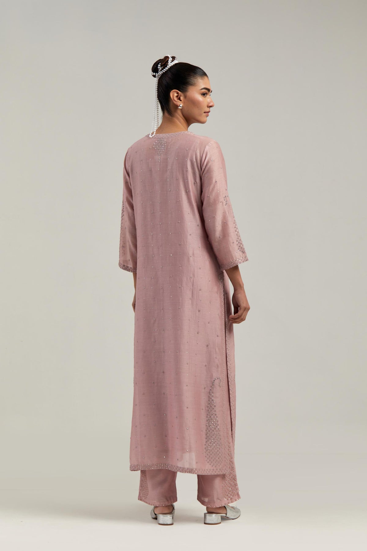 Pink silk Chanderi straight kurta set with hand-embroidered paisley motifs with delicate mirror and sequins work at neck, hem, and sleeves, with narrow borders along the edges.