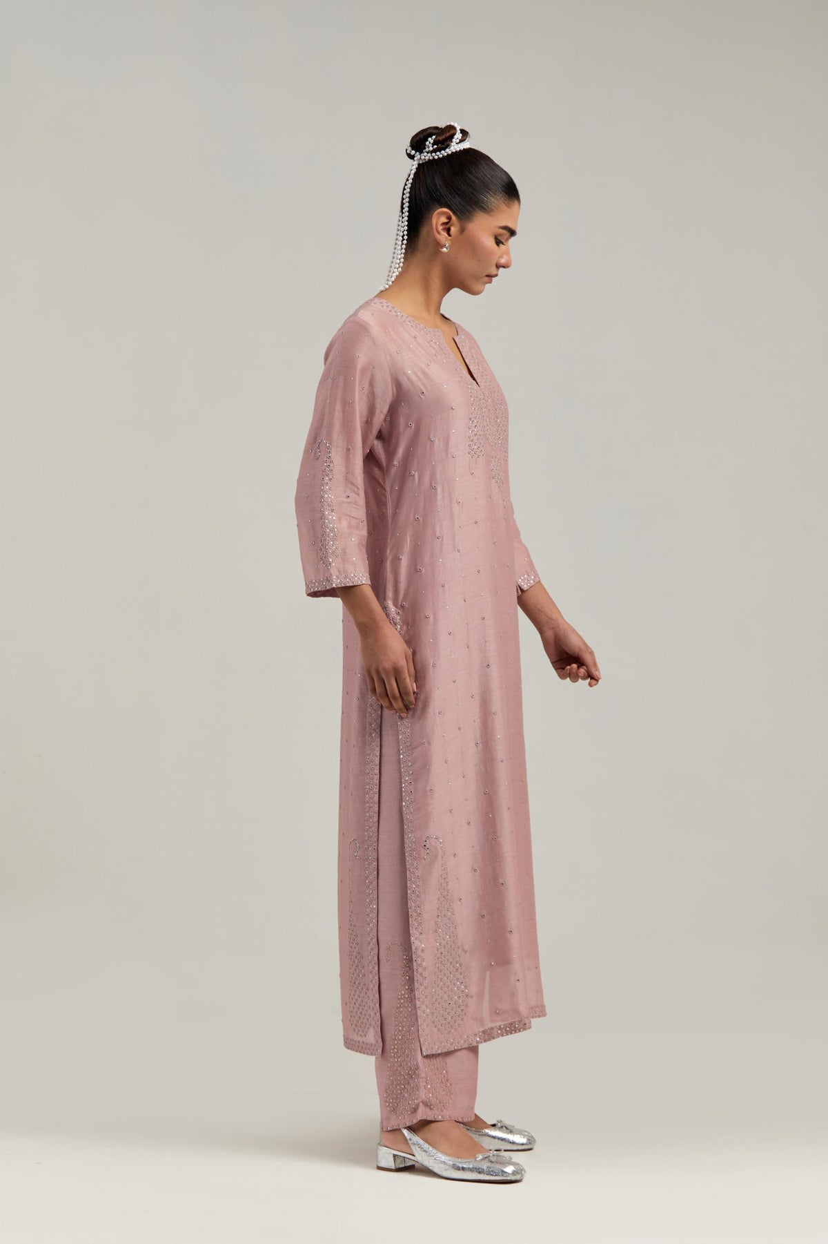 Pink silk Chanderi straight kurta set with hand-embroidered paisley motifs with delicate mirror and sequins work at neck, hem, and sleeves, with narrow borders along the edges.