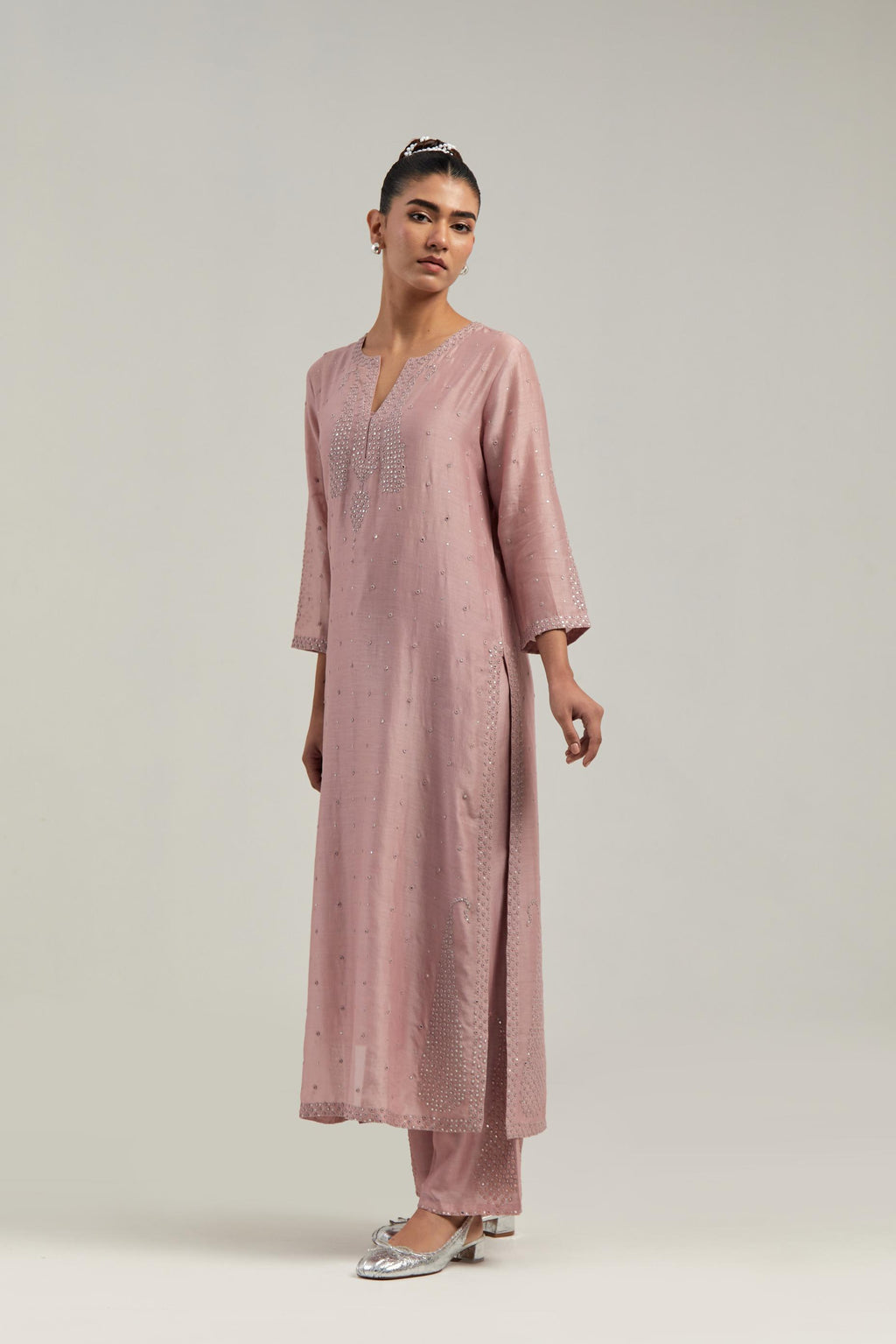 Pink silk Chanderi straight kurta set with hand-embroidered paisley motifs with delicate mirror and sequins work at neck, hem, and sleeves, with narrow borders along the edges.