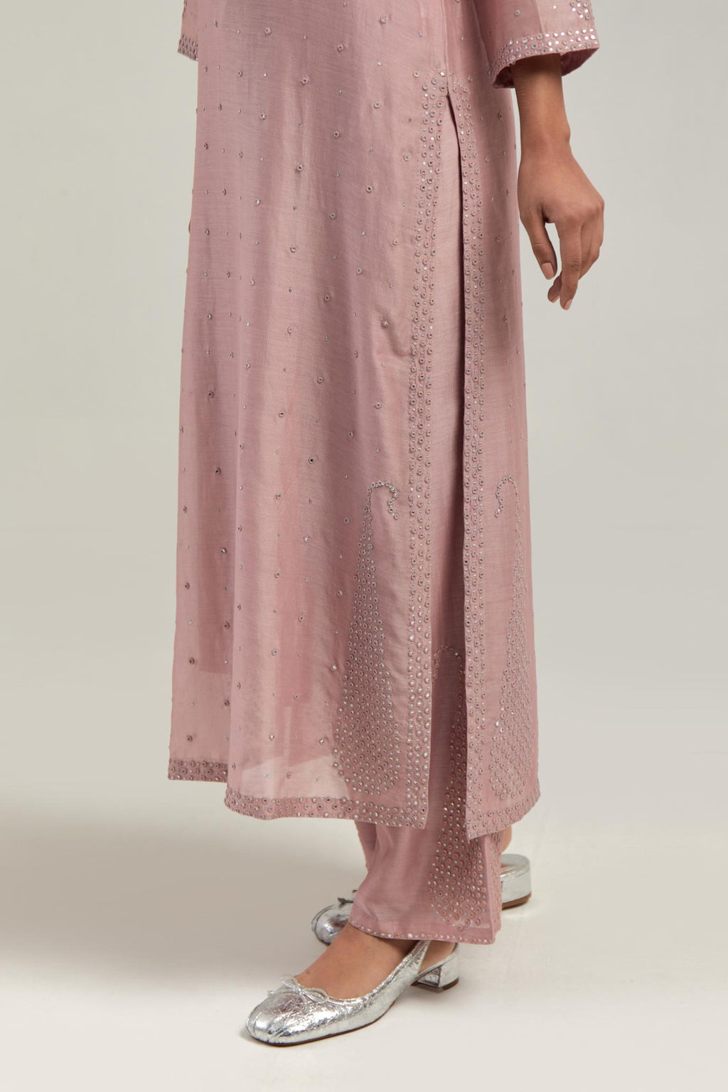 Pink silk Chanderi straight kurta set with hand-embroidered paisley motifs with delicate mirror and sequins work at neck, hem, and sleeves, with narrow borders along the edges.