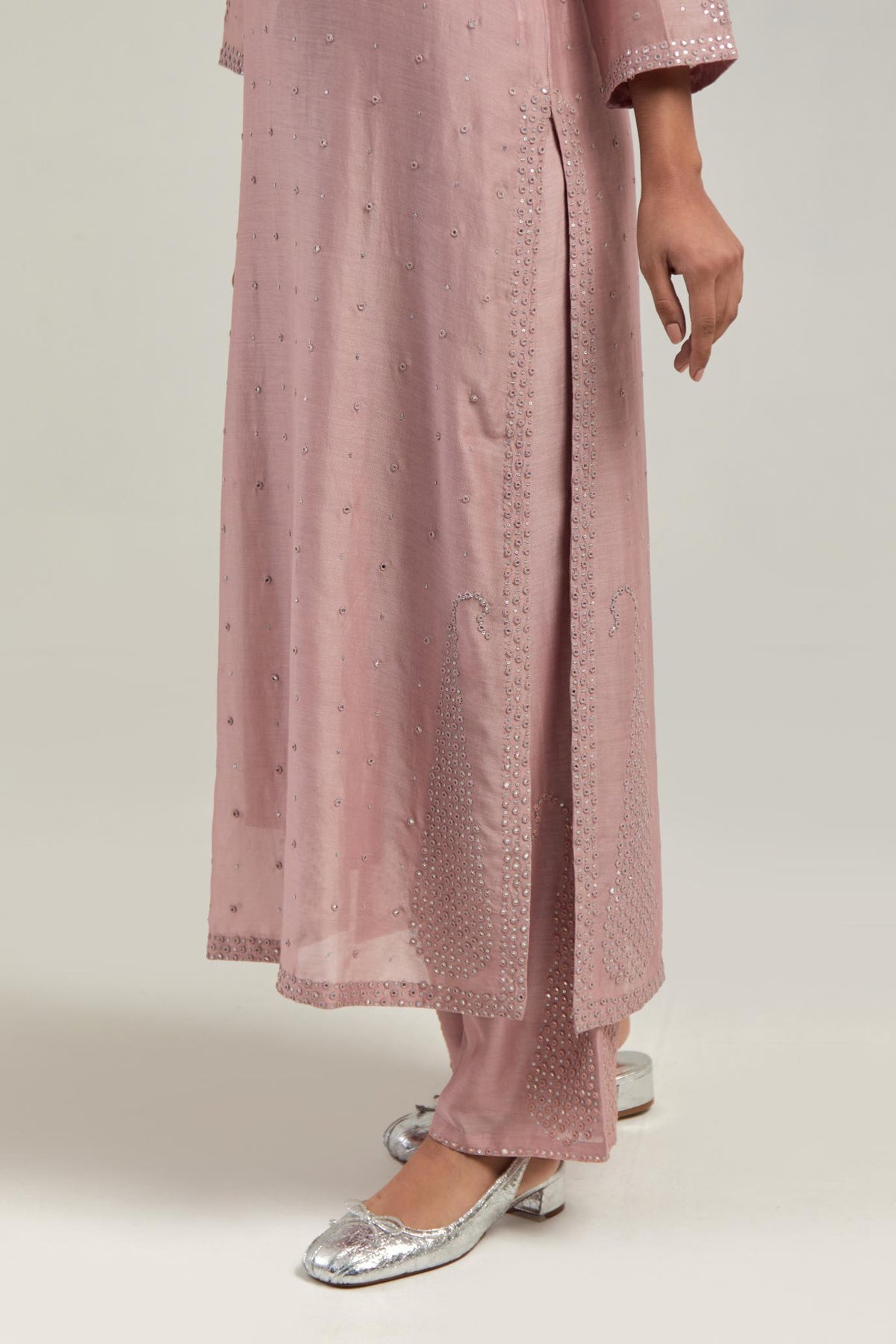 Pink silk Chanderi straight kurta set with hand-embroidered paisley motifs with delicate mirror and sequins work at neck, hem, and sleeves, with narrow borders along the edges.