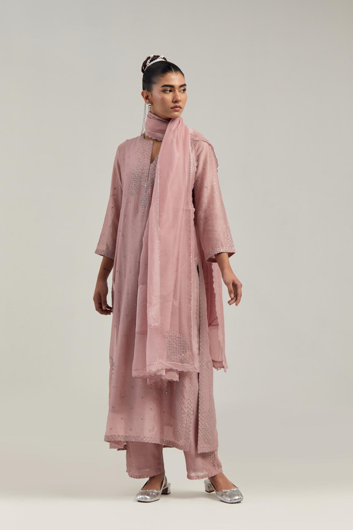 Pink silk Chanderi straight kurta set with hand-embroidered paisley motifs with delicate mirror and sequins work at neck, hem, and sleeves, with narrow borders along the edges.