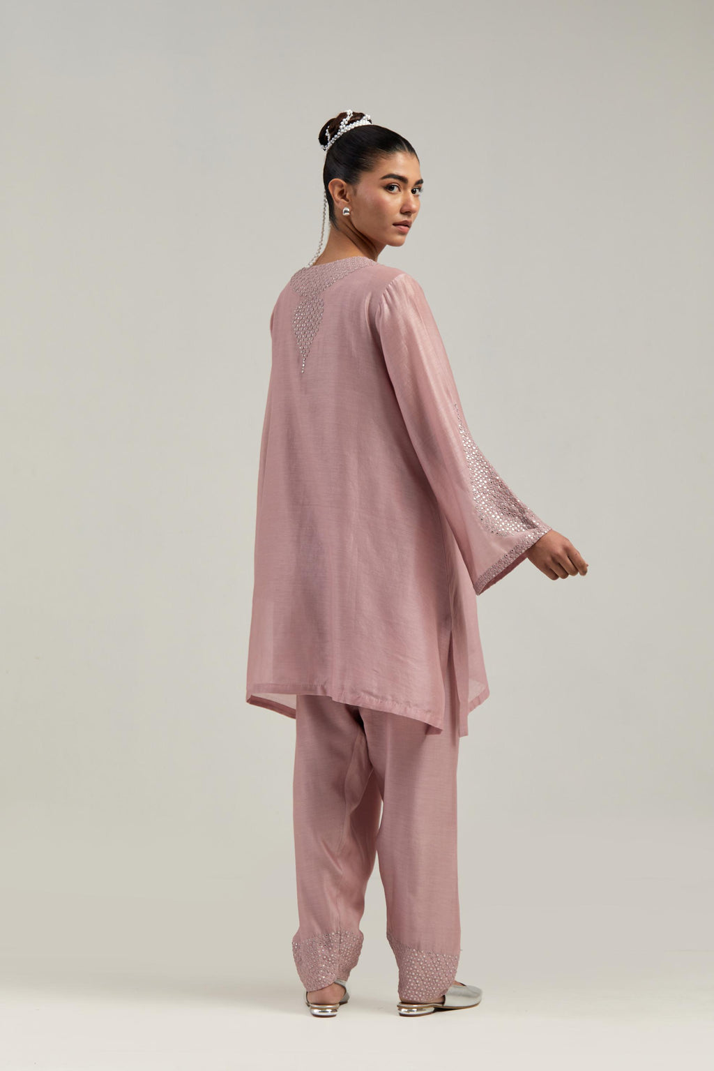 Pink silk Chanderi short A-line kurta set with hand-embroidered mirror work at the neck and bell sleeves.