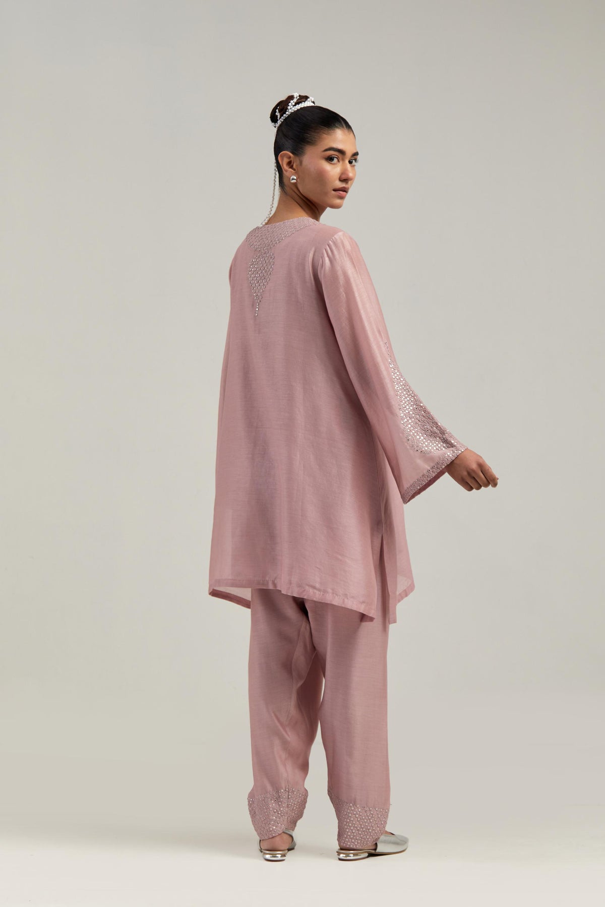 Pink silk Chanderi short A-line kurta set with hand-embroidered mirror work at the neck and bell sleeves.