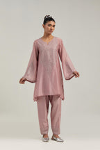 Pink silk Chanderi short A-line kurta set with hand-embroidered mirror work at the neck and bell sleeves.