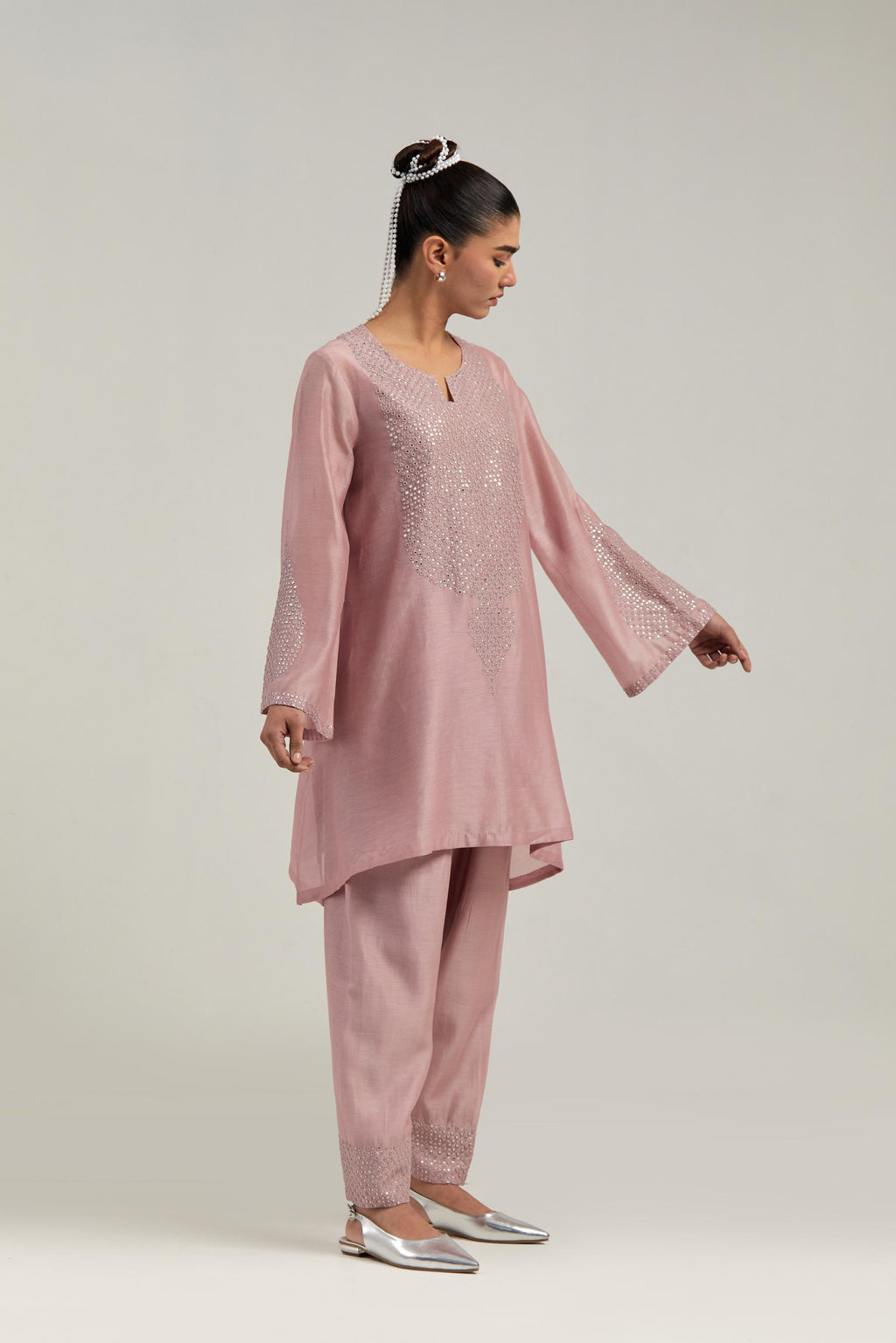 Pink silk Chanderi short A-line kurta set with hand-embroidered mirror work at the neck and bell sleeves.