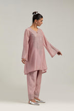 Pink silk Chanderi short A-line kurta set with hand-embroidered mirror work at the neck and bell sleeves.