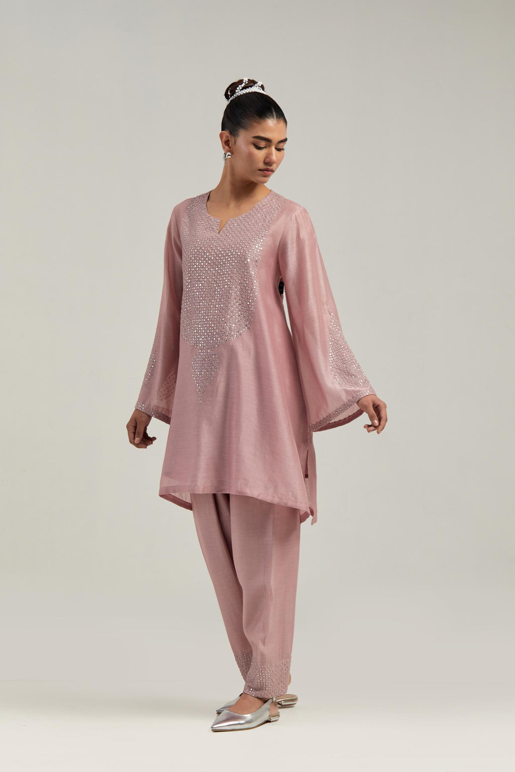 Pink silk Chanderi short A-line kurta set with hand-embroidered mirror work at the neck and bell sleeves.