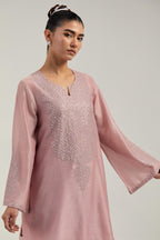 Pink silk Chanderi short A-line kurta set with hand-embroidered mirror work at the neck and bell sleeves.