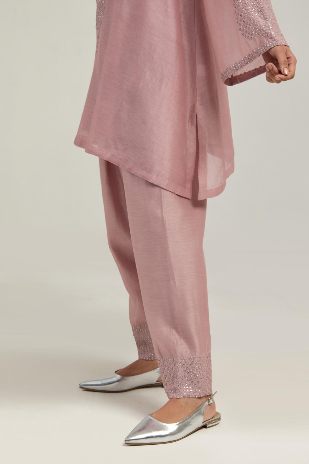 Pink silk Chanderi short A-line kurta set with hand-embroidered mirror work at the neck and bell sleeves.