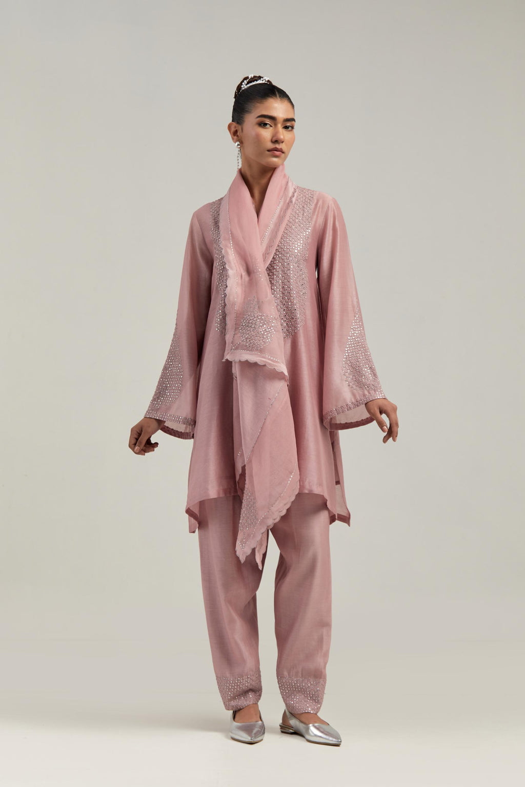 Pink silk Chanderi short A-line kurta set with hand-embroidered mirror work at the neck and bell sleeves.