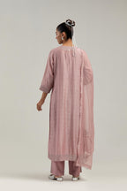 Pink silk Chanderi straight kurta set with hand-embroidered mirror at the neck, hem and sleeves, highlighted with scattered silver sequin and mirror embellishments all-over.