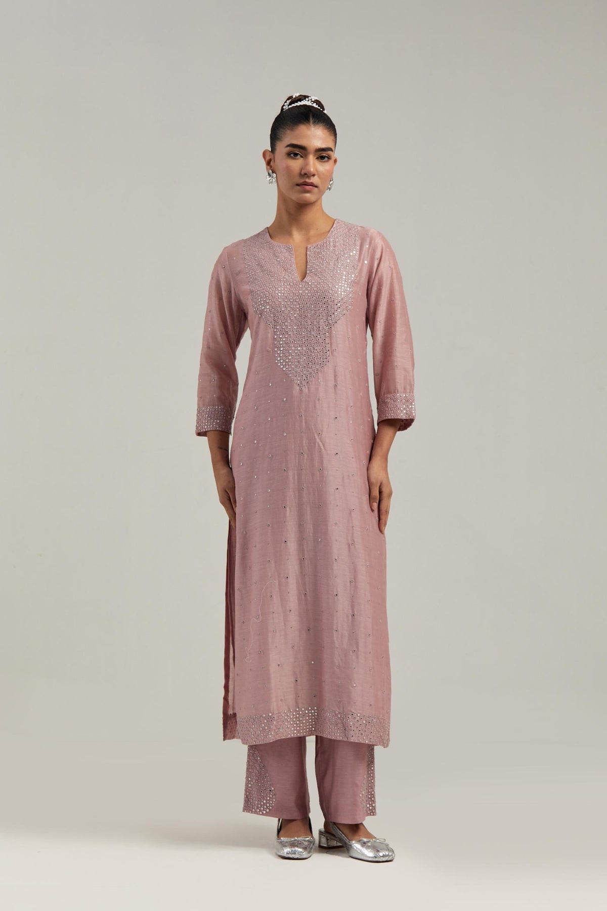 Pink silk Chanderi straight kurta set with hand-embroidered mirror at the neck, hem and sleeves, highlighted with scattered silver sequin and mirror embellishments all-over.