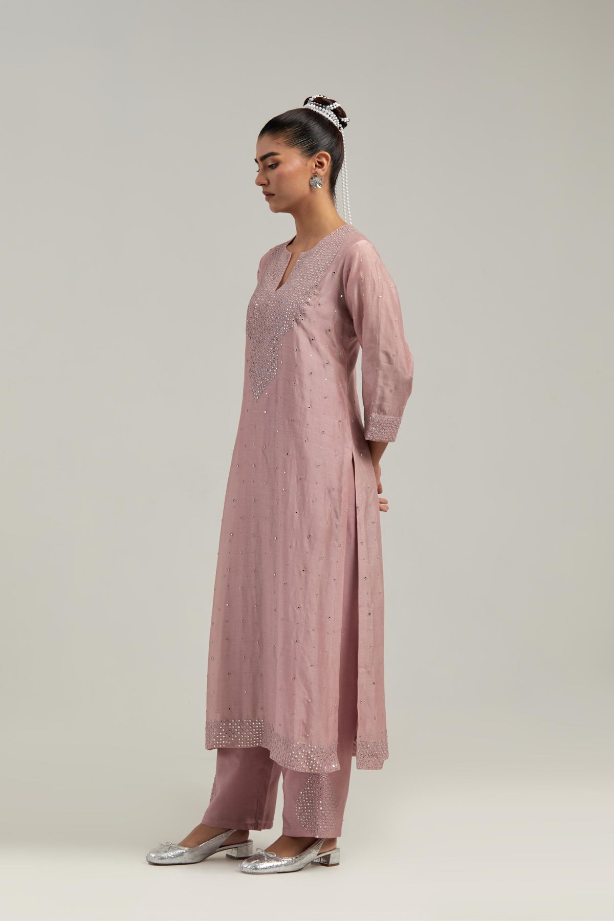 Pink silk Chanderi straight kurta set with hand-embroidered mirror at the neck, hem and sleeves, highlighted with scattered silver sequin and mirror embellishments all-over.