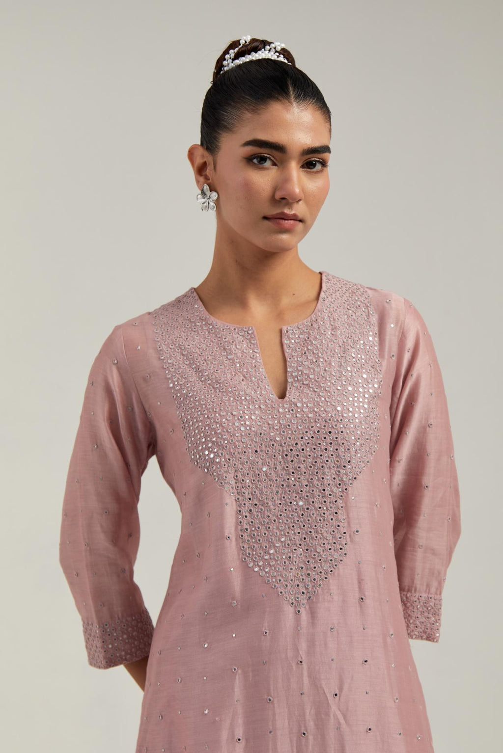 Pink silk Chanderi straight kurta set with hand-embroidered mirror at the neck, hem and sleeves, highlighted with scattered silver sequin and mirror embellishments all-over.