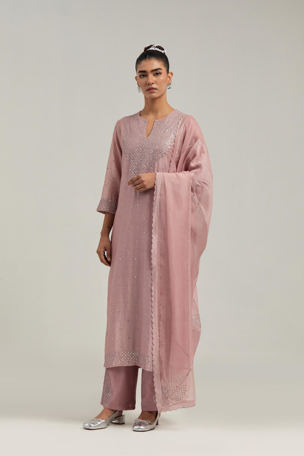 Pink silk Chanderi dupatta with silk organza at the sides, finished with delicate scalloped edges, highlighted by hand-embroidered mirror & sequins work.