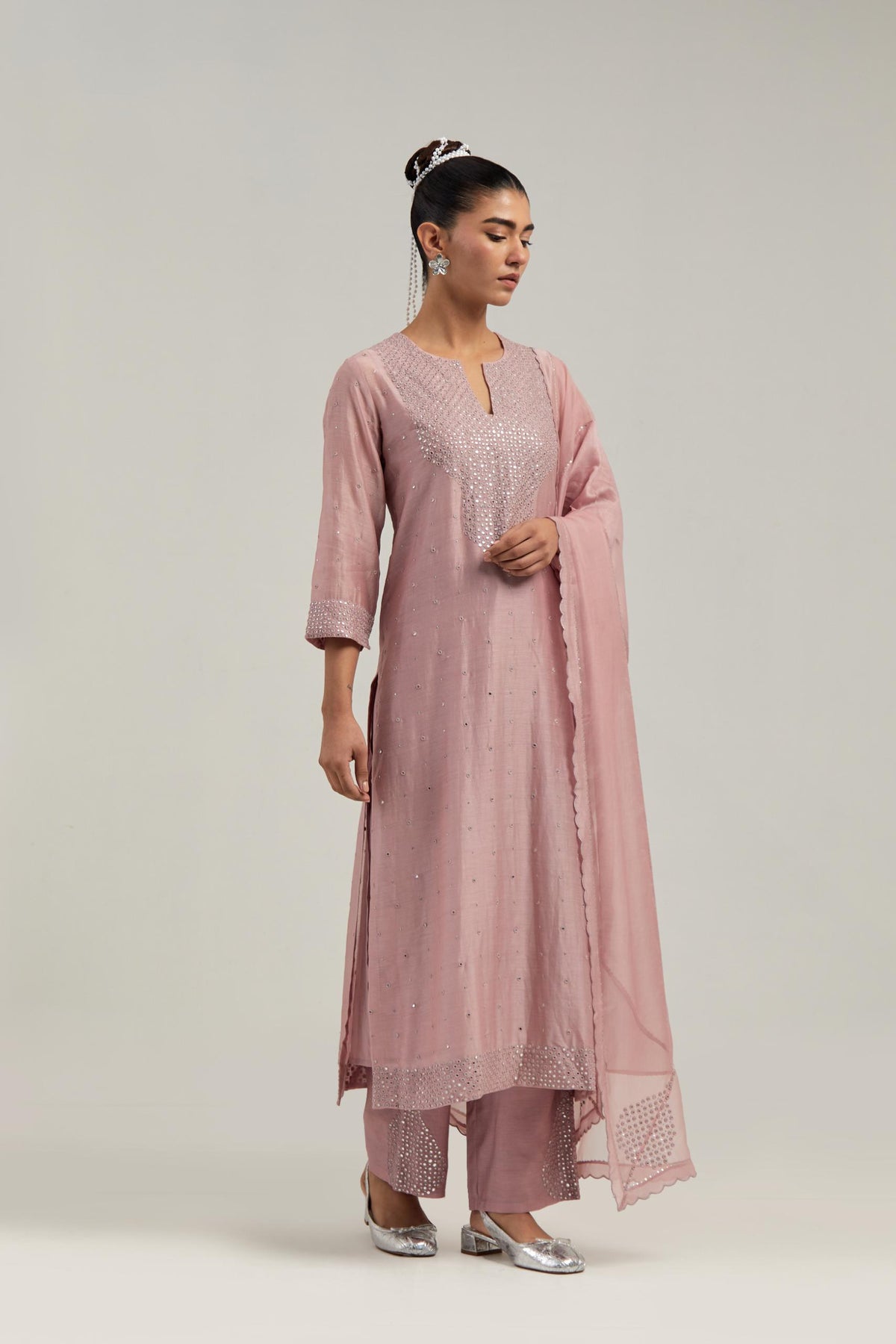 Pink silk Chanderi straight kurta set with hand-embroidered mirror at the neck, hem and sleeves, highlighted with scattered silver sequin and mirror embellishments all-over.