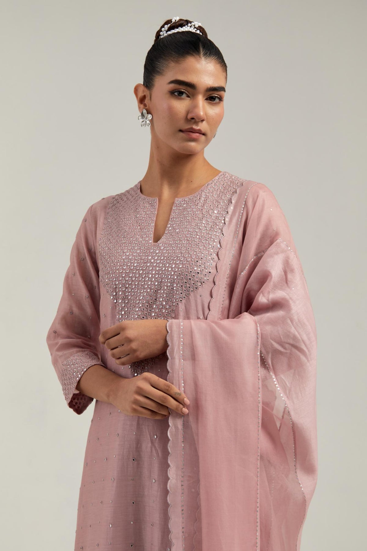 Pink silk Chanderi dupatta with silk organza at the sides, finished with delicate scalloped edges, highlighted by hand-embroidered mirror & sequins work.