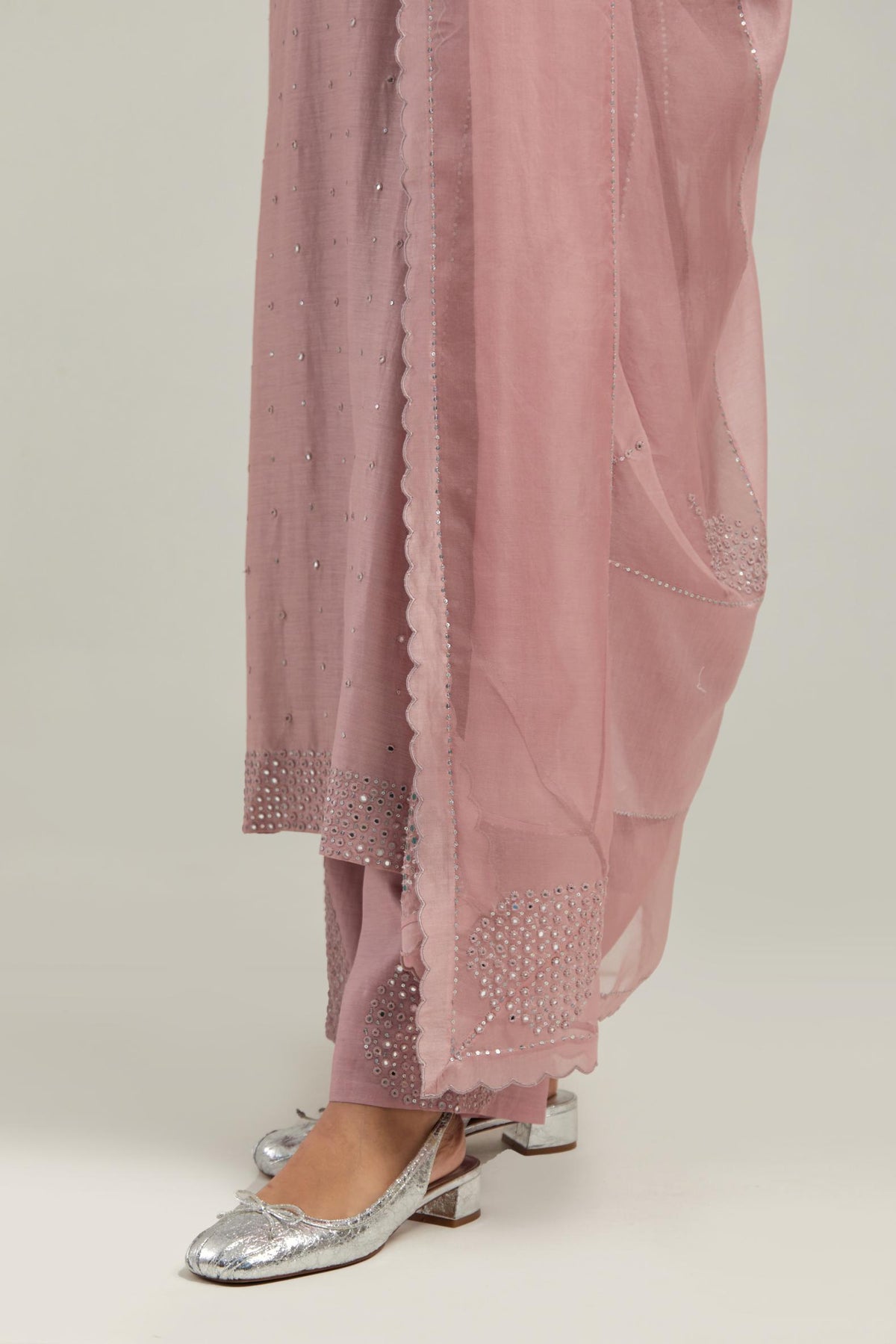 Pink silk Chanderi dupatta with silk organza at the sides, finished with delicate scalloped edges, highlighted by hand-embroidered mirror & sequins work.