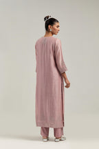 Pink silk Chanderi straight kurta set with hand-embroidered mirror at the neck, borders running along the hem and sleeve edges, and scattered silver sequin and mirror embellishments all-over.