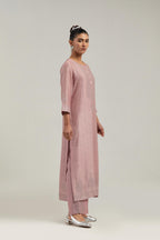 Pink silk Chanderi straight kurta set with hand-embroidered mirror at the neck, borders running along the hem and sleeve edges, and scattered silver sequin and mirror embellishments all-over.