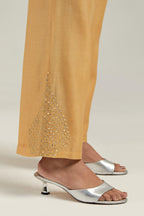 Yellow Silk Chanderi pants with hand embroidered leaf motifs with delicate mirror & sequins work at hem.