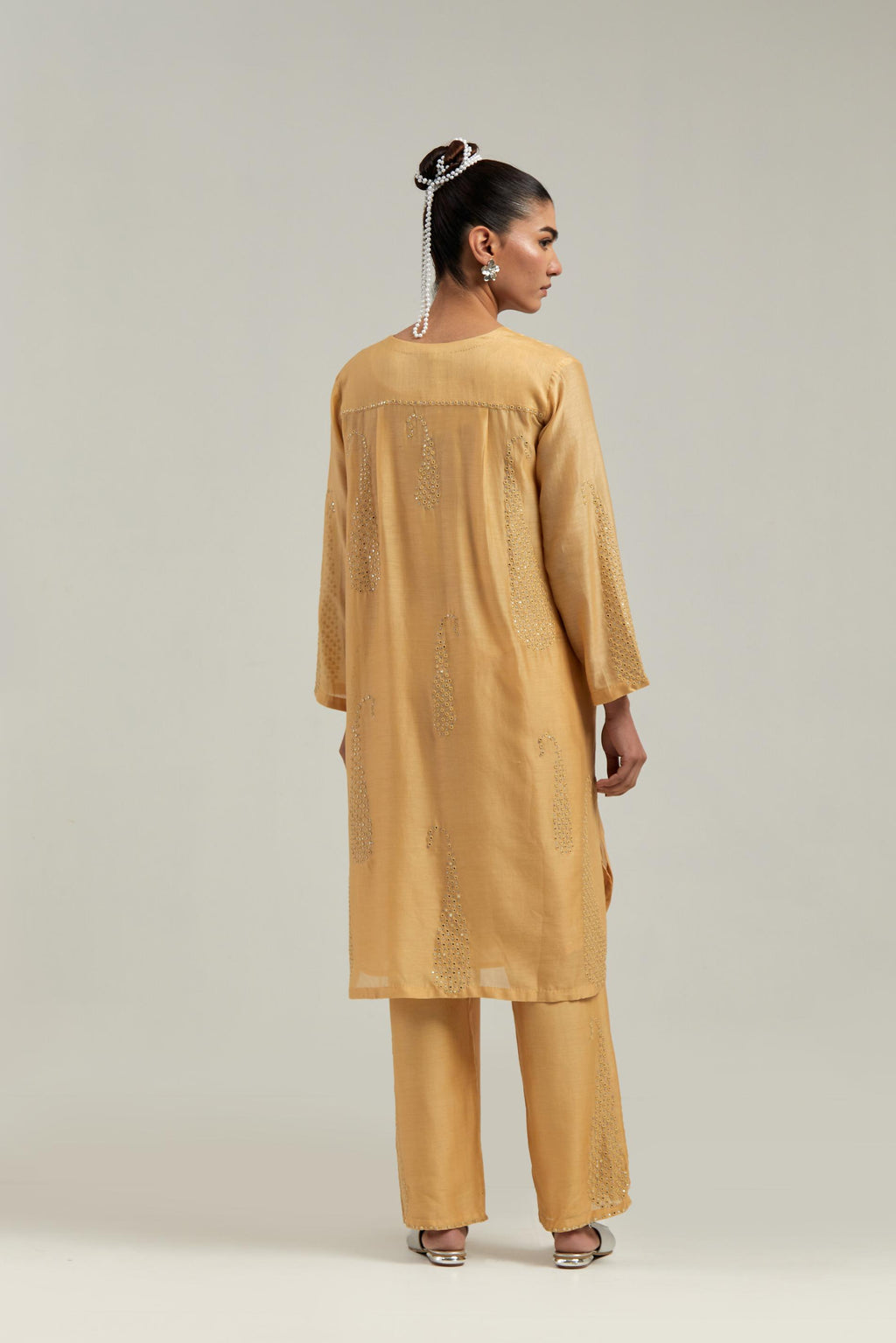 Yellow Silk Chanderi short kurta set with hand-embroidered paisley motifs with delicate mirror and sequins work all-over the kurta.