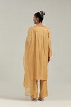 Yellow Silk Chanderi short kurta set with hand-embroidered paisley motifs with delicate mirror and sequins work all-over the kurta.