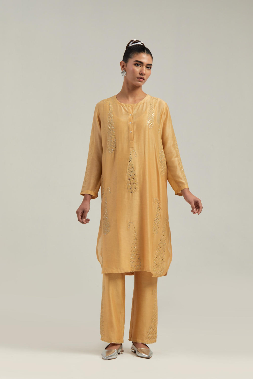 Yellow Silk Chanderi short kurta set with hand-embroidered paisley motifs with delicate mirror and sequins work all-over the kurta.