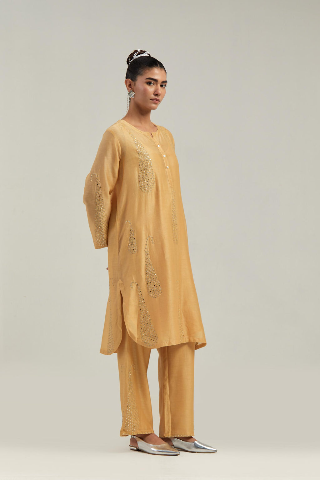 Yellow Silk Chanderi short kurta set with hand-embroidered paisley motifs with delicate mirror and sequins work all-over the kurta.