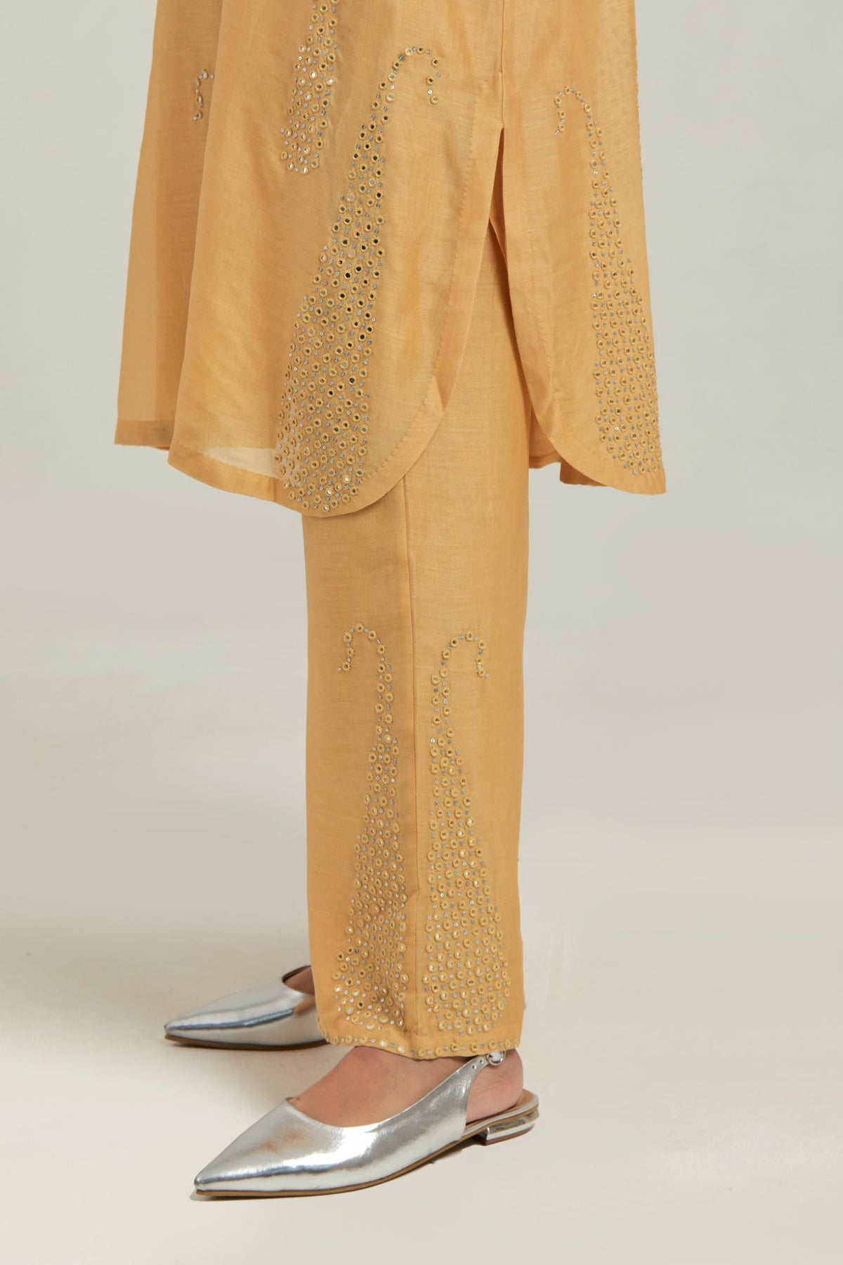 Yellow Silk Chanderi short kurta set with hand-embroidered paisley motifs with delicate mirror and sequins work all-over the kurta.