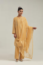 Yellow silk Chanderi dupatta with silk organza at the sides, finished with delicate scalloped edges, highlighted by hand-embroidered mirror & sequins work.