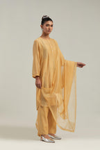 Yellow silk Chanderi dupatta with silk organza at the sides, finished with delicate scalloped edges, highlighted by hand-embroidered mirror & sequins work.