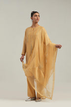 Yellow silk Chanderi dupatta with silk organza at the sides, finished with delicate scalloped edges, highlighted by hand-embroidered mirror & sequins work.