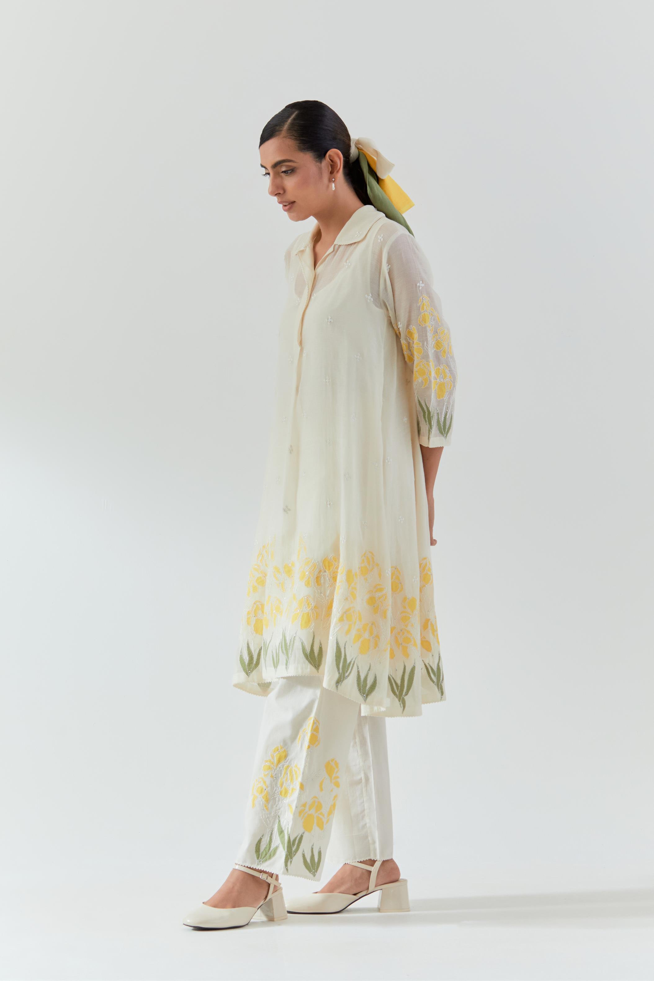 Off white cotton chanderi A-line short kurta set with yellow & green applique work at hem, highlighted with bead & sequins work.