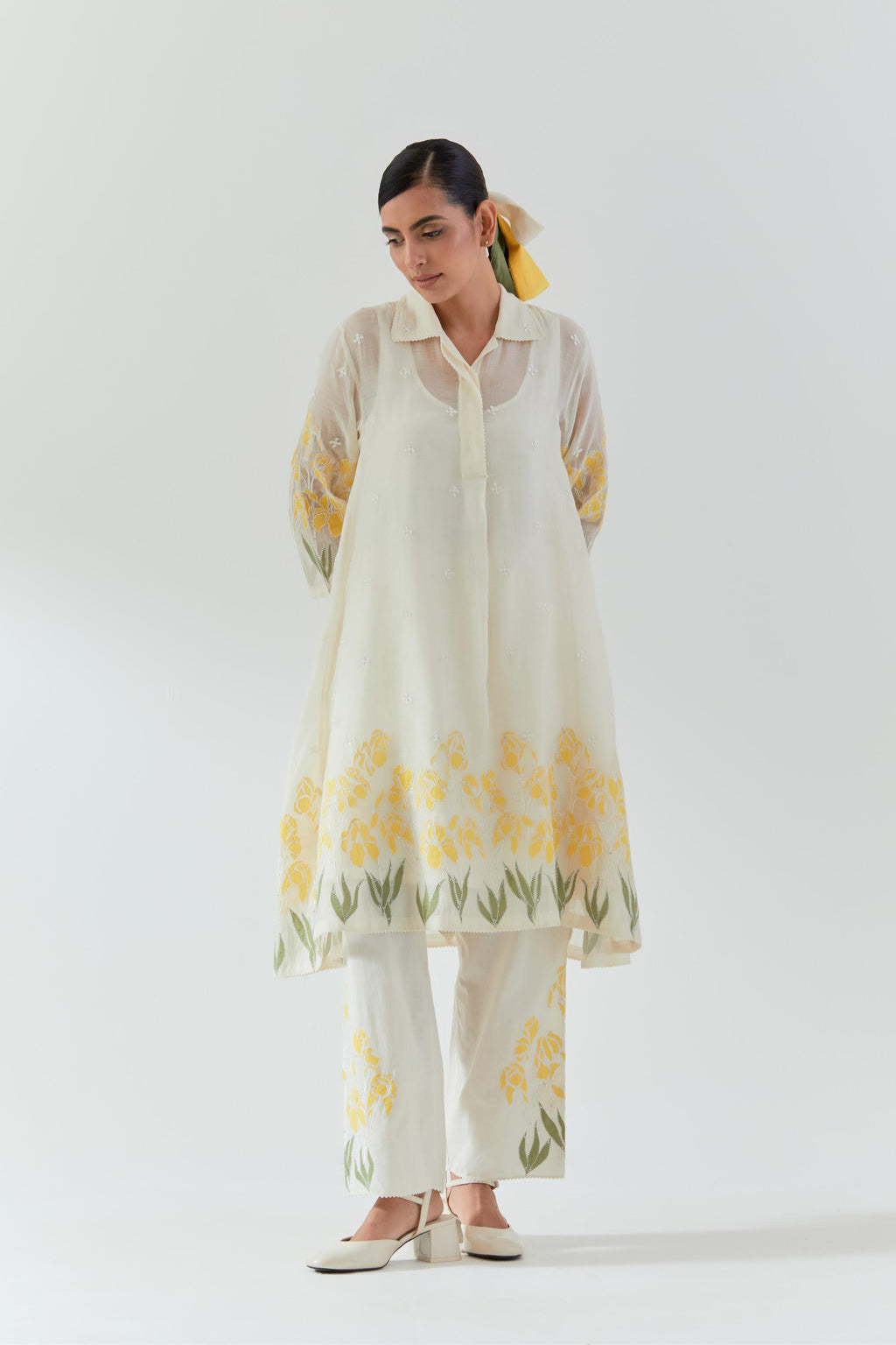 Off white cotton chanderi A-line short kurta set with yellow & green applique work at hem, highlighted with bead & sequins work.
