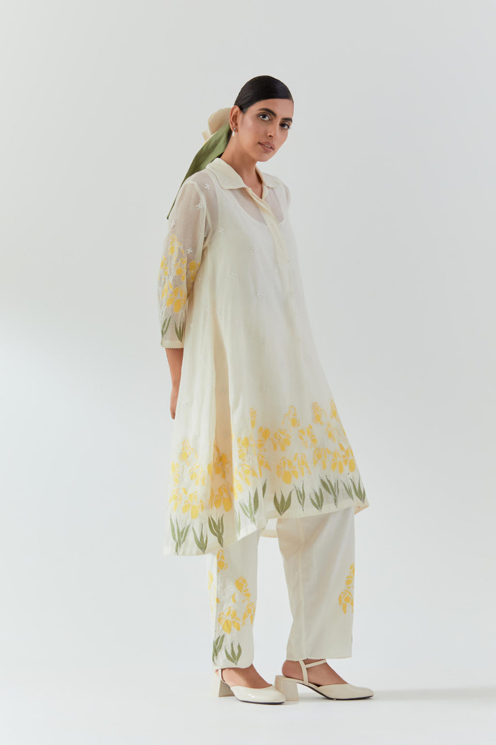 Off white cotton chanderi A-line short kurta set with yellow & green applique work at hem, highlighted with bead & sequins work.