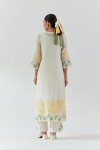 Off white cotton chanderi straight kurta set, decorated with yellow & green appliqué at the hem and sleeves.