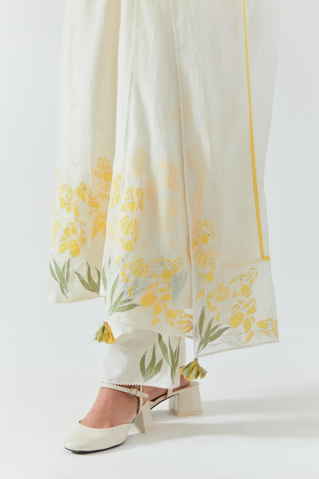 Off white cotton chanderi dupatta with yellow & green colored applique, highlighted with bead & sequins work.