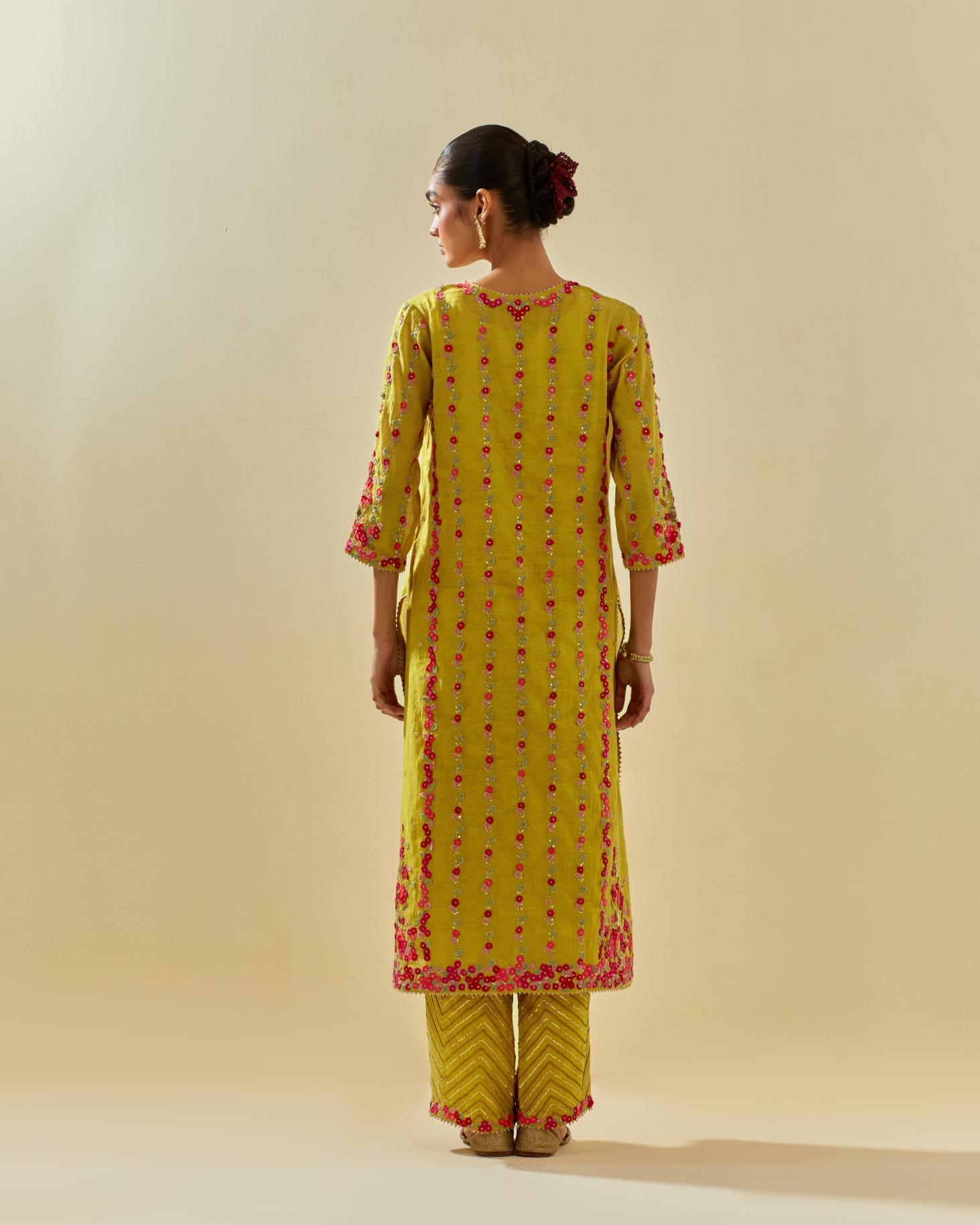 Yellow tissue chanderi paneled kurta set with front placket neckline and all-over hand cut silk flower embroidery.