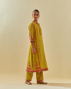 Yellow tissue chanderi paneled kurta set with front placket neckline and all-over hand cut silk flower embroidery.