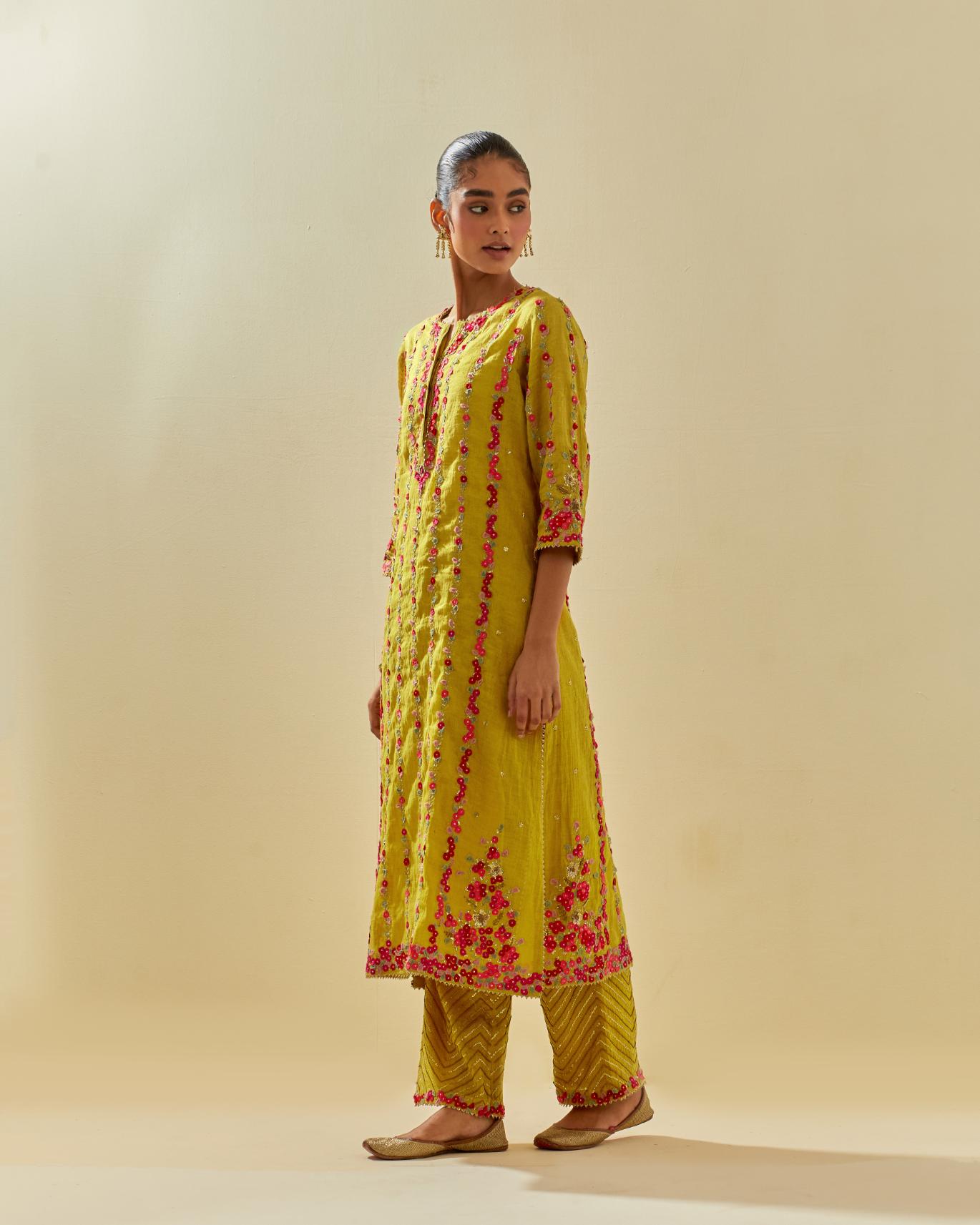 Yellow tissue chanderi paneled kurta set with front placket neckline and all-over hand cut silk flower embroidery.