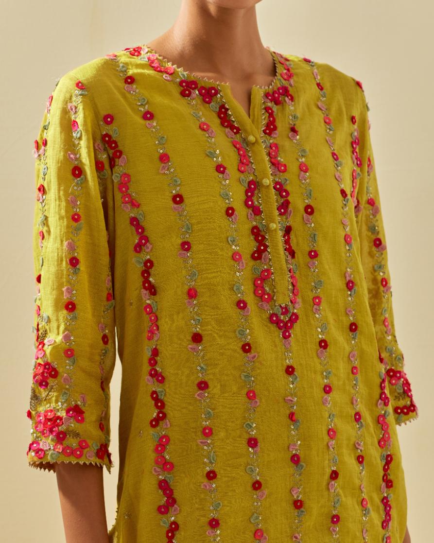 Yellow tissue chanderi paneled kurta set with front placket neckline and all-over hand cut silk flower embroidery.