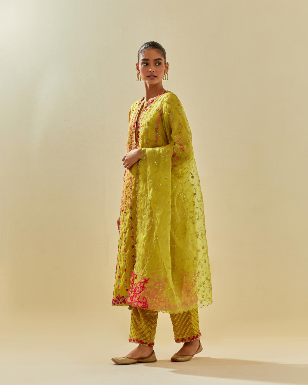 Yellow tissue chanderi paneled kurta set with front placket neckline and all-over hand cut silk flower embroidery.