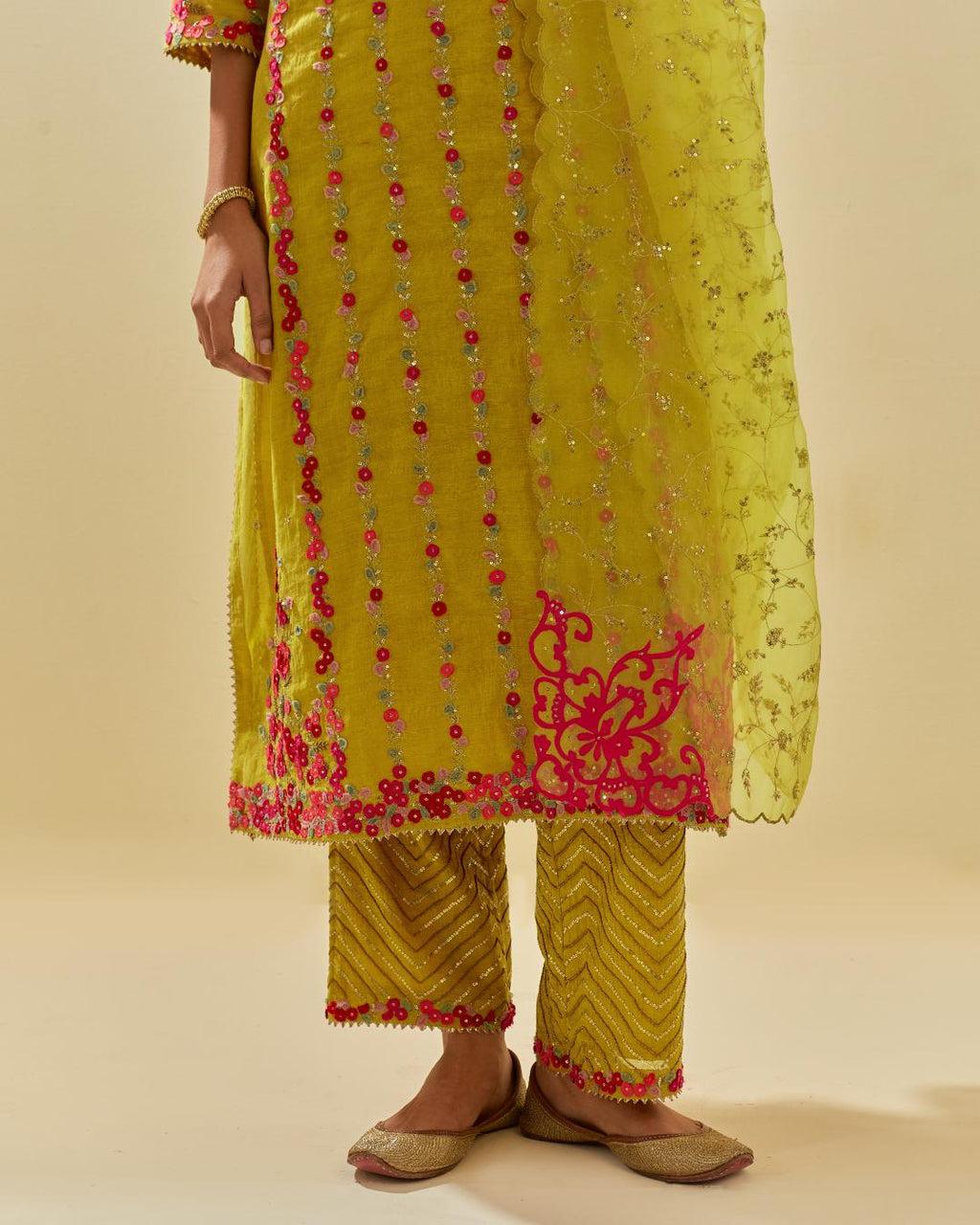 Yellow tissue chanderi paneled kurta set with front placket neckline and all-over hand cut silk flower embroidery.