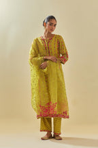 Yellow tissue chanderi paneled kurta set with front placket neckline and all-over hand cut silk flower embroidery.