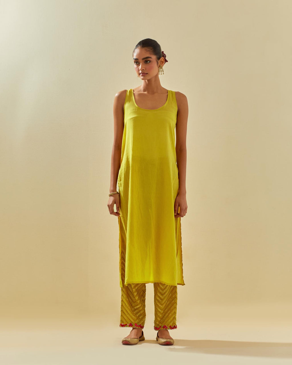 Yellow tissue chanderi paneled kurta set with front placket neckline and all-over hand cut silk flower embroidery.
