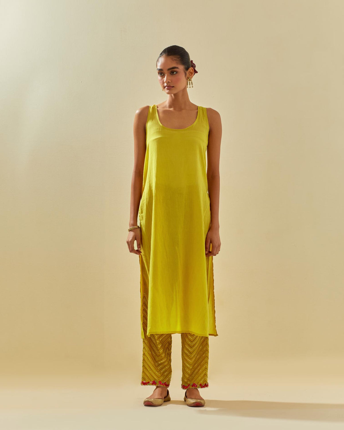 Yellow tissue chanderi paneled kurta set with front placket neckline and all-over hand cut silk flower embroidery.