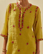 Yellow tissue chanderi straight kurta set, with contrast silk hand cut flowers embroidery, highlighted with gold sequins.