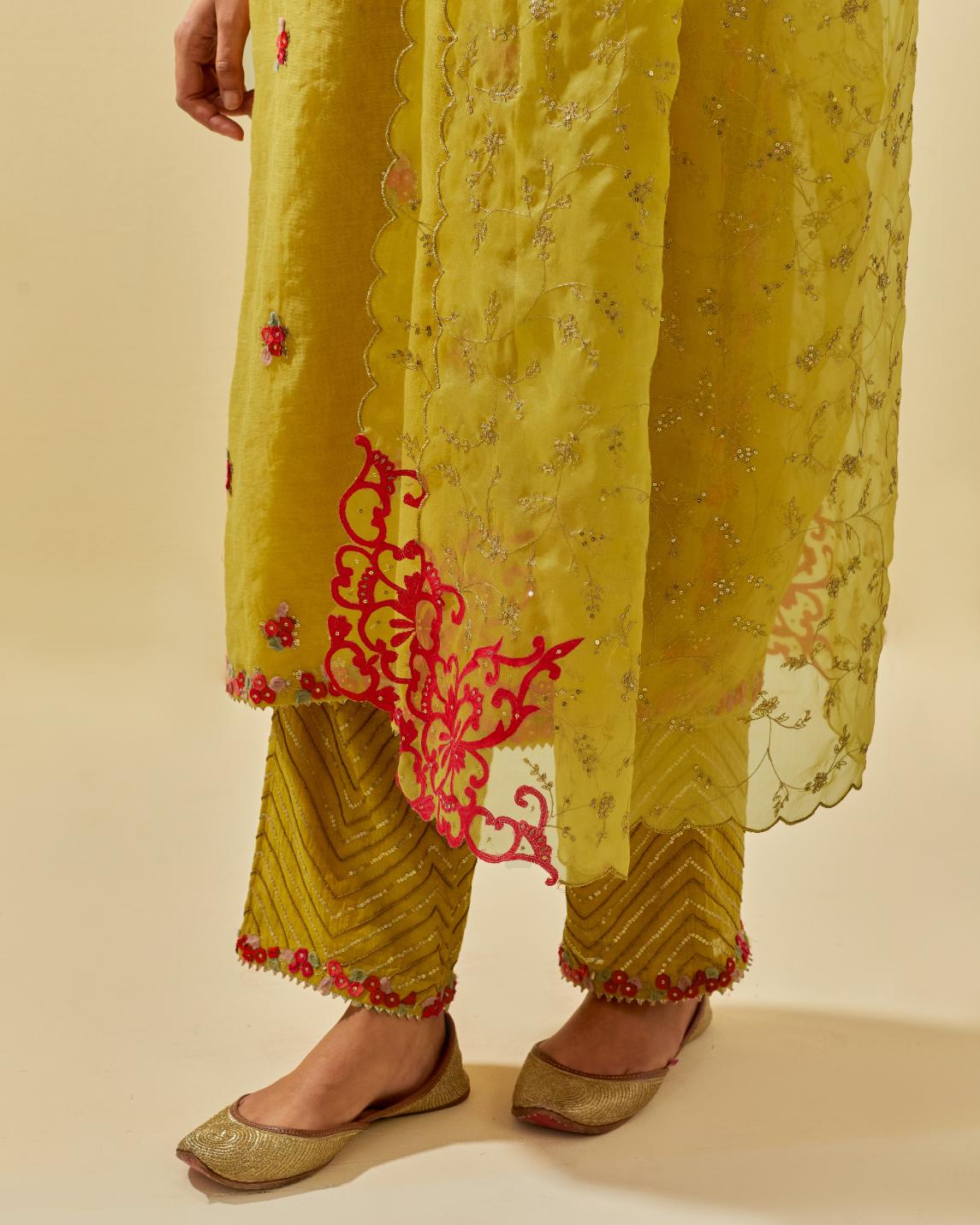 Yellow tissue chanderi straight kurta set, with contrast silk hand cut flowers embroidery, highlighted with gold sequins.